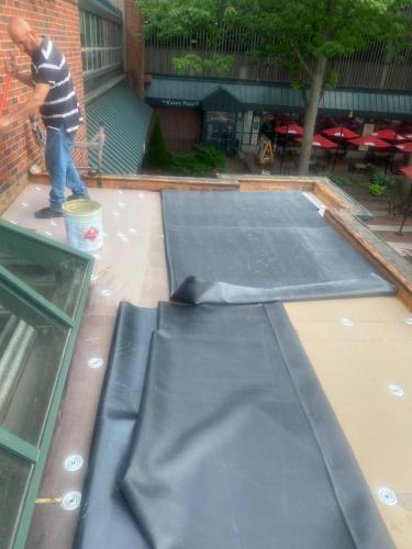 New rubberized roof installation