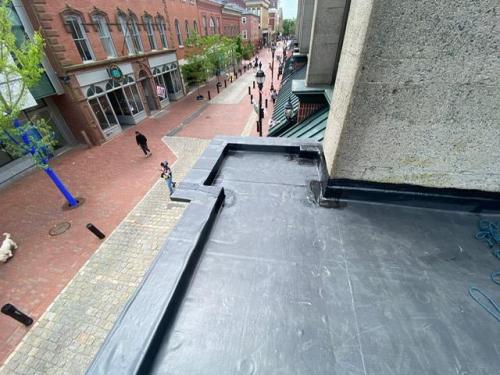 New rubberized roof installation